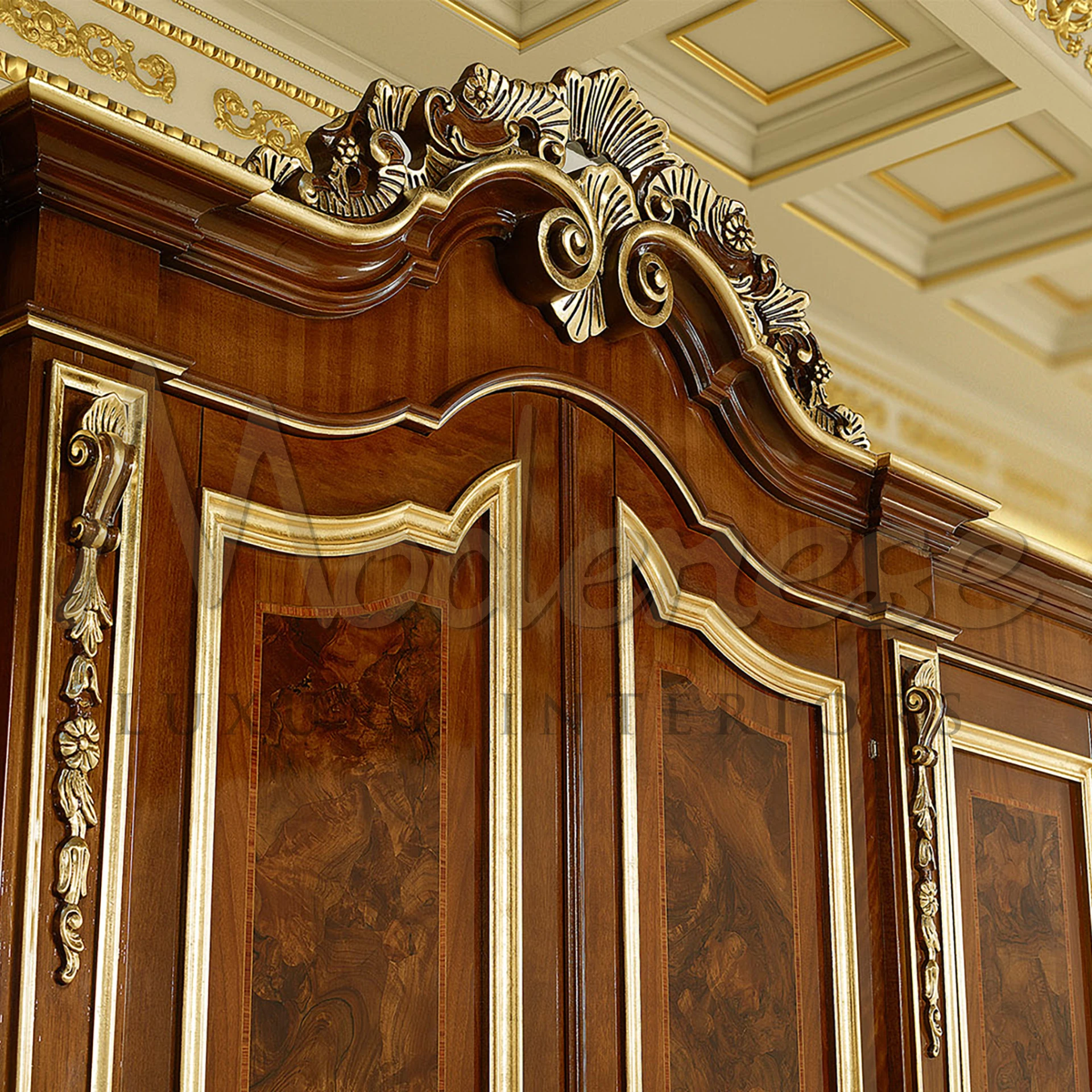  Vintage wooden wardrobe with curved doors and intricate gold leaf detailing.