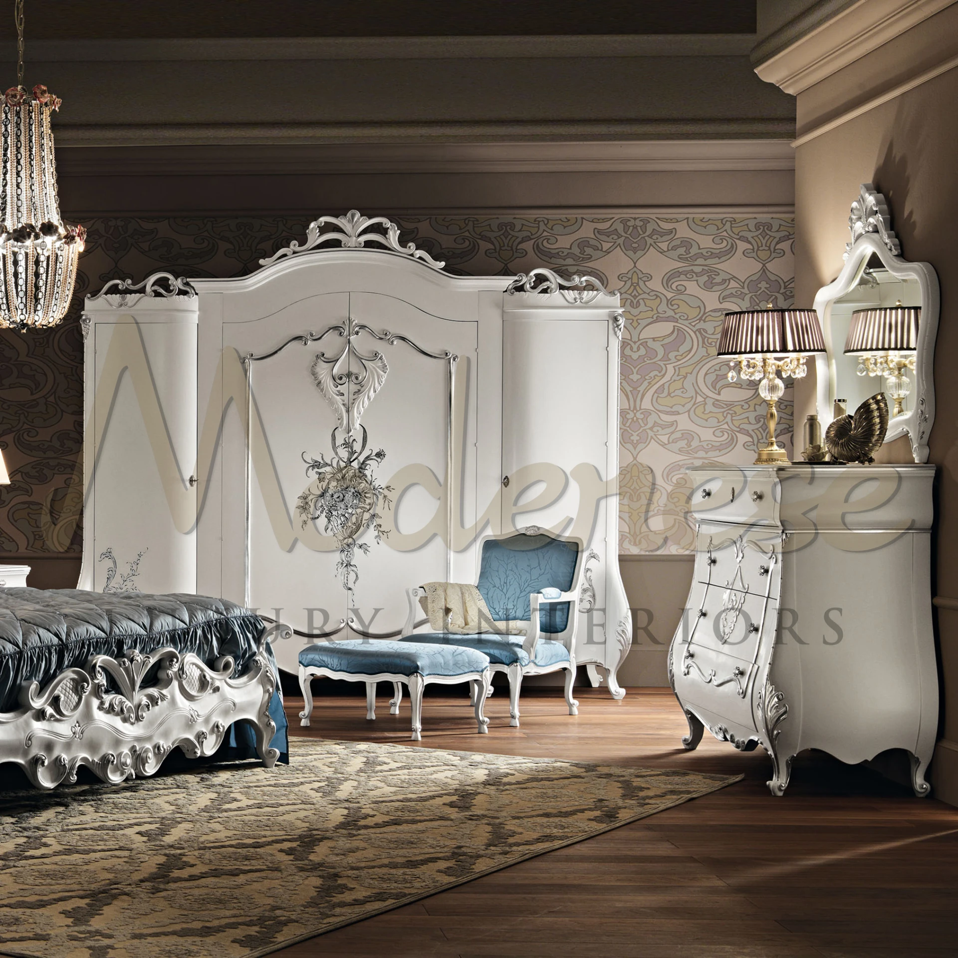 Artisan-crafted wardrobe with elaborate carvings in a silver hue.                                                                                             