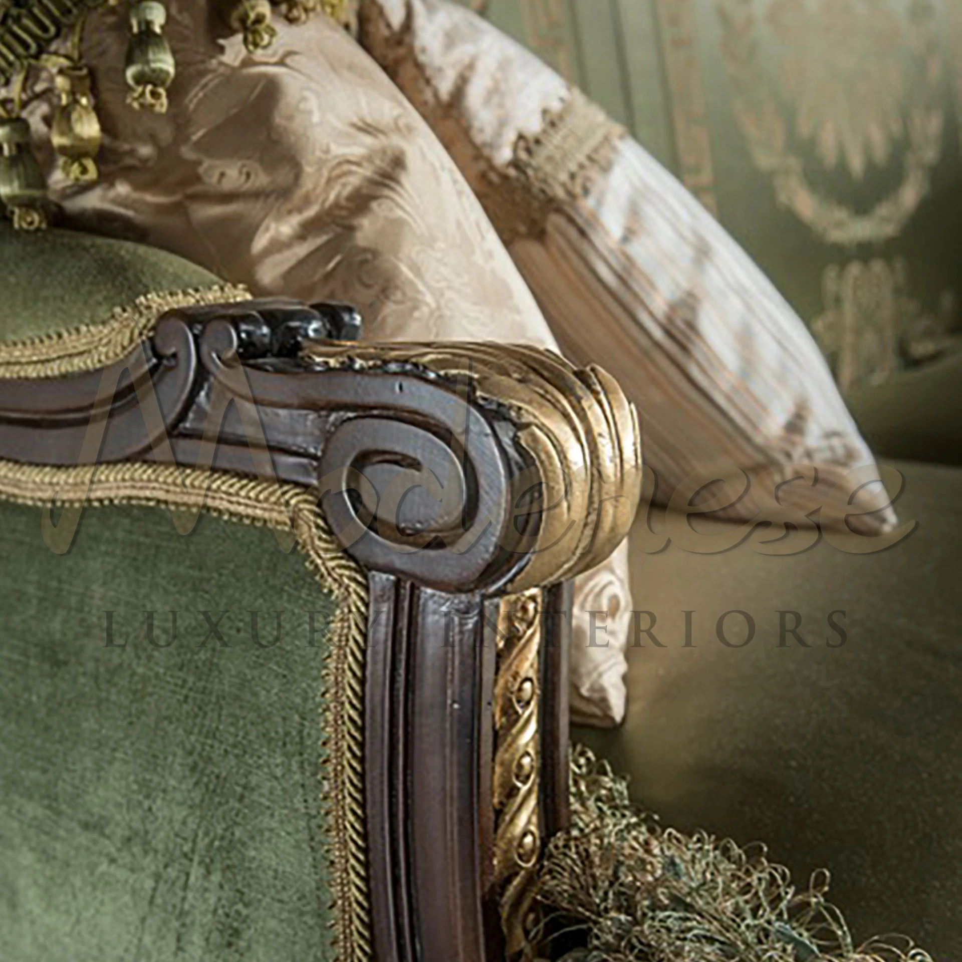 Stately armchair with deep green upholstery and elaborate gold-leaf details on a classic Victorian silhouette with turned wooden legs.