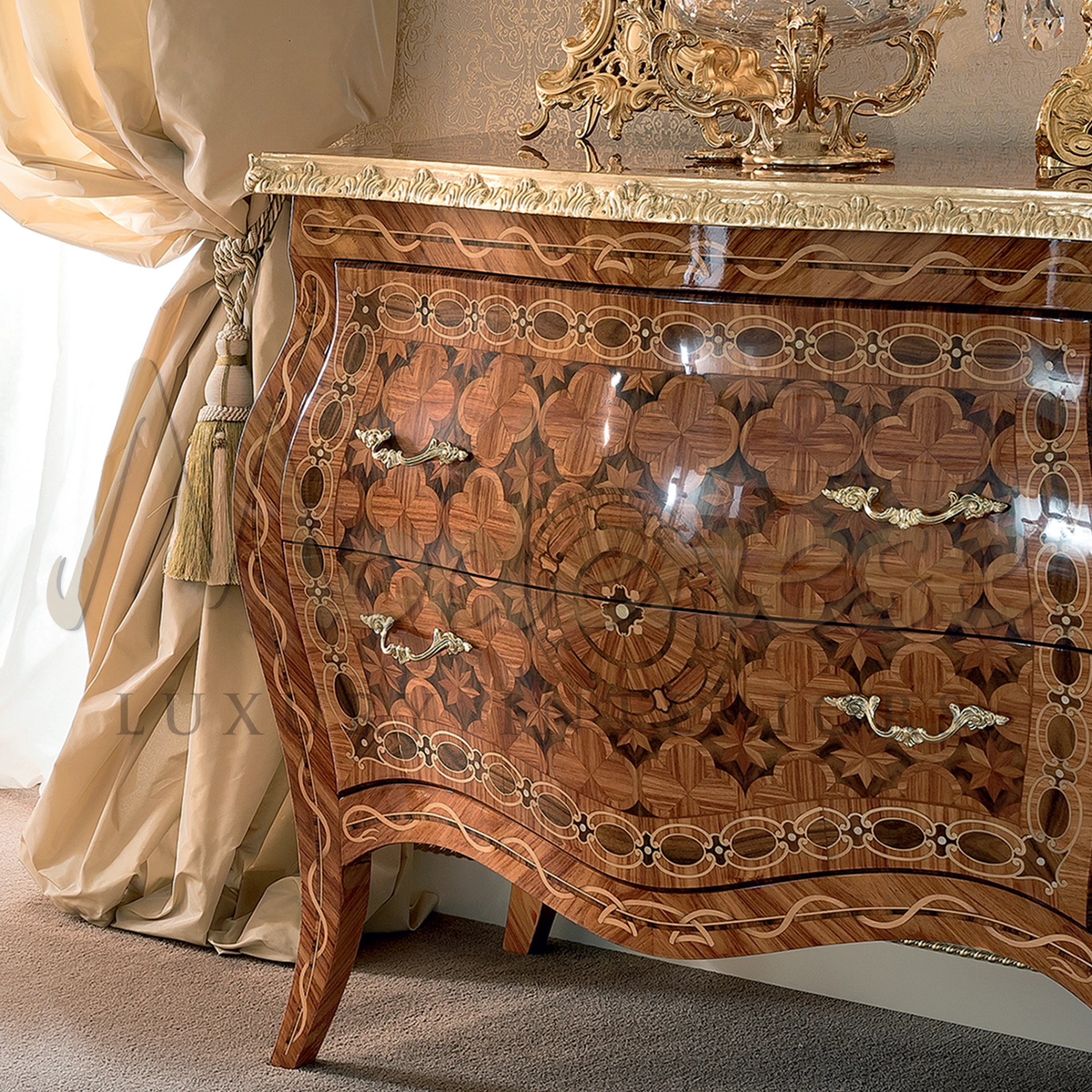 A fancy hand carved wooden sideboard with pretty flower design and shiny gold handles
