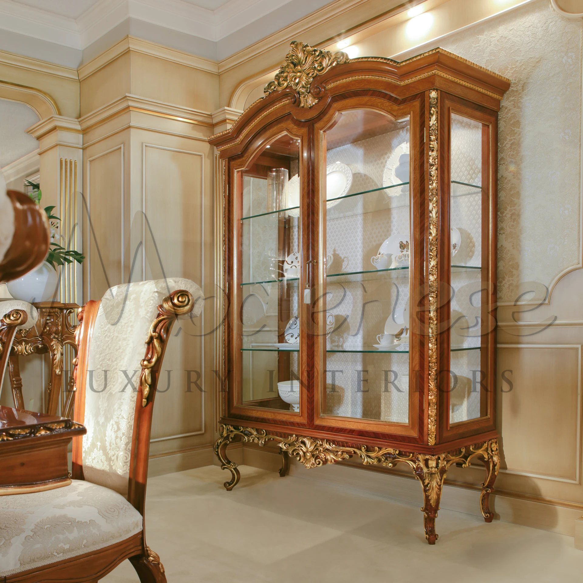 A fancy wooden classic walnut cabinet with glass doors showing beautiful dishes.