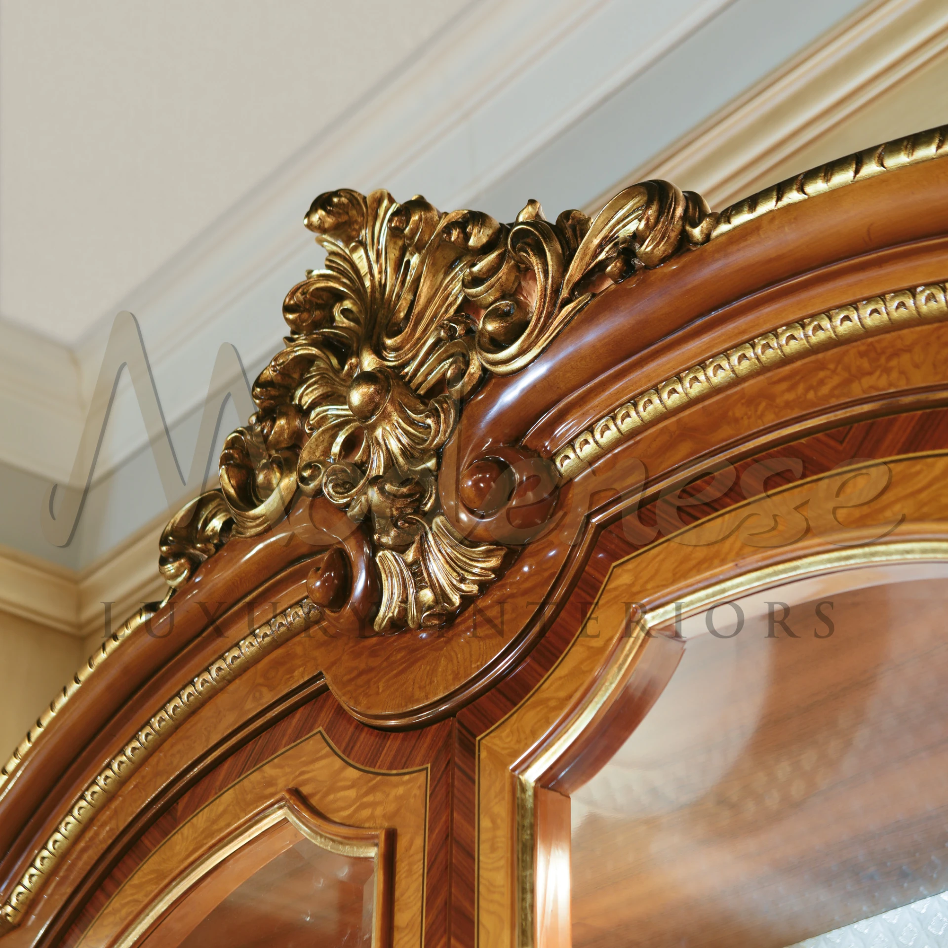 Close up view of a luxurious classic wooden cabinet with golden floral design