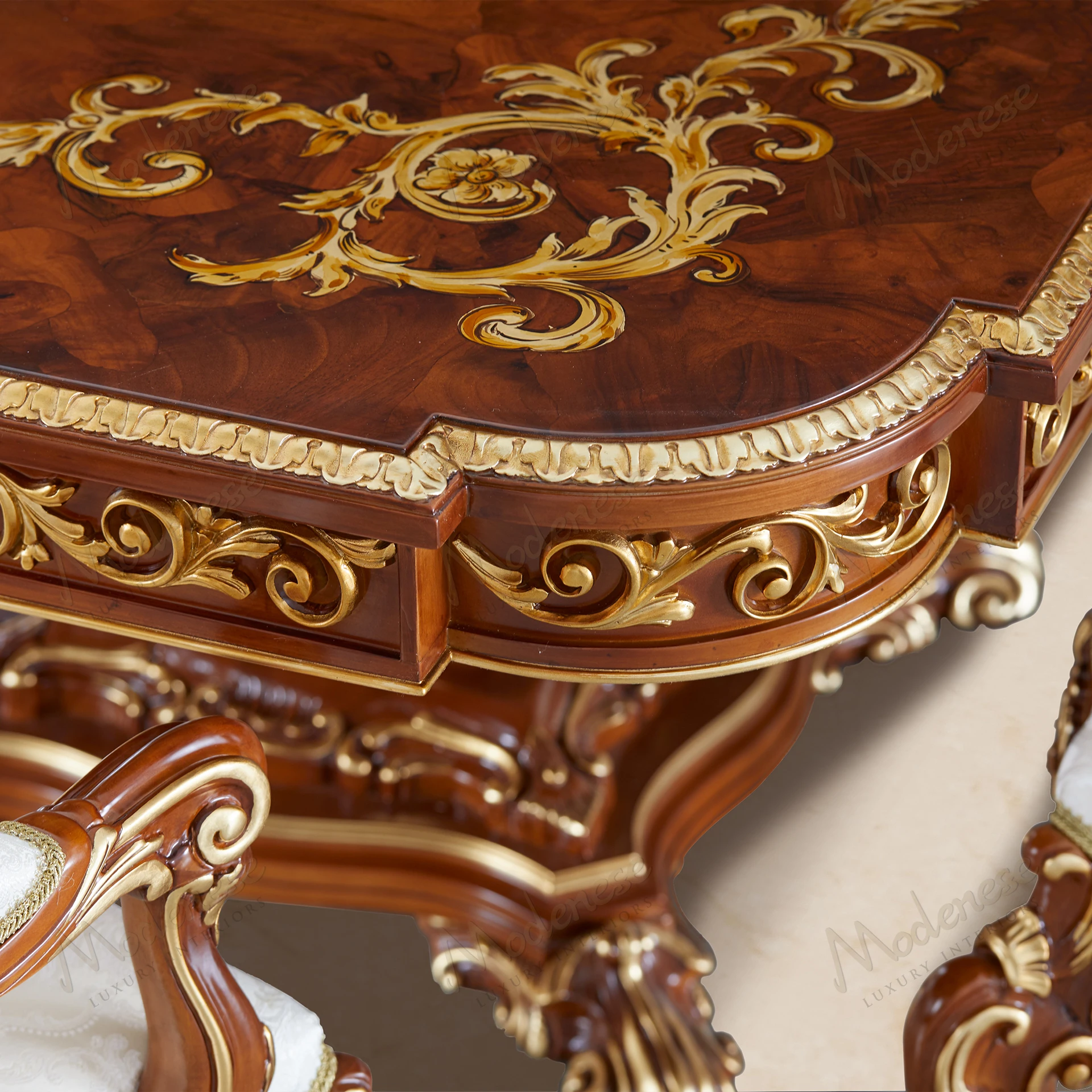 Elegant Carved Symmetry Dining Table with walnut finish, gold leaf accents, and inlaid top, showcasing an artistic, fabric-free design..