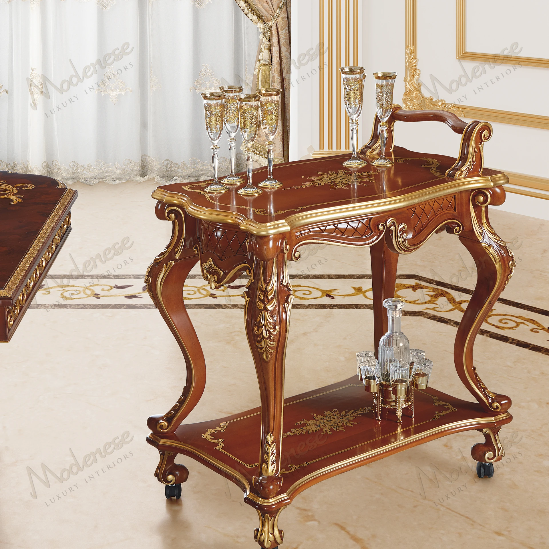 Elegant tea cart with classic walnut finish, intricate carved symmetry, and gold leaf details. Perfect for serving tea in style