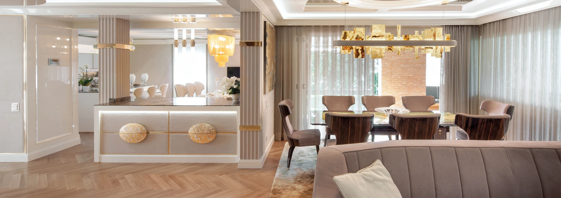 A sleek armchair from the FAOMA EVOLUTION new collection, showcasing the seamless joinery between a polished metal frame and rich, dark leather upholstery.