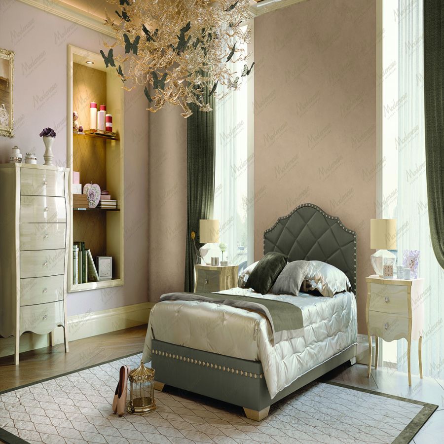 The dramatic interplay of light and shadow across a deep charcoal wall in a MODENESE PROJECT interior, highlighting the sophisticated use of dark colors to create depth and atmosphere.