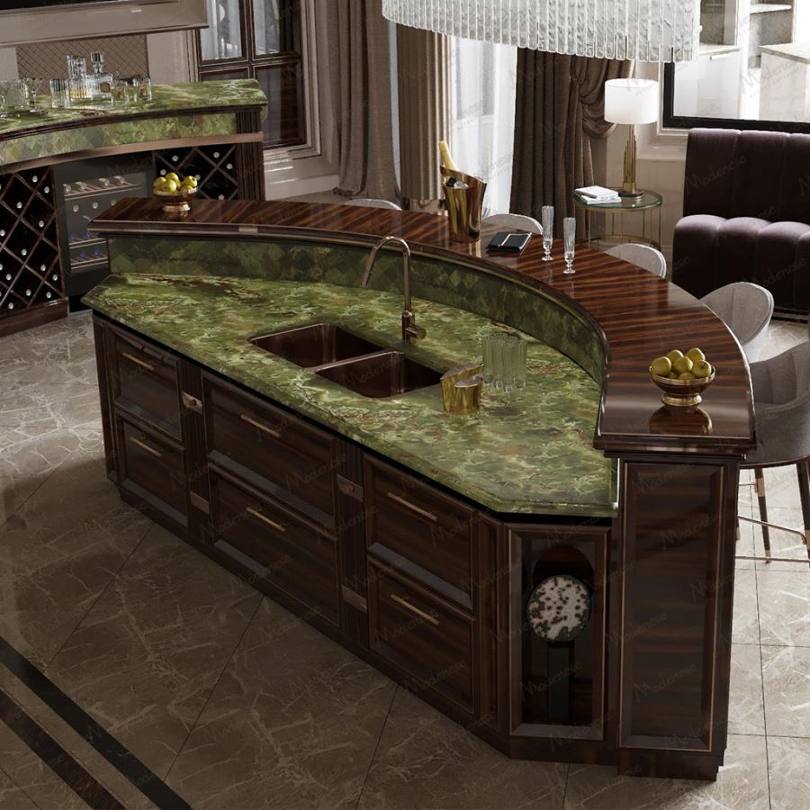 A spacious and light-filled tailored kitchen by Modenese, highlighting a functional layout with an integrated dining area and seamless storage solutions.