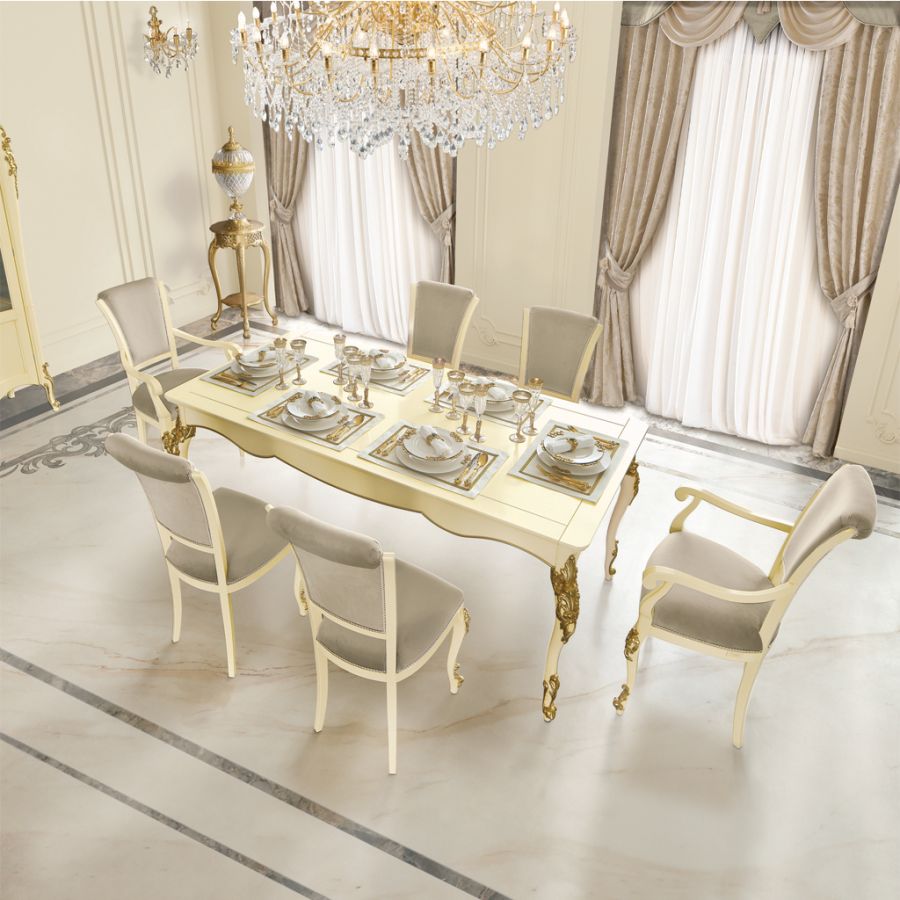 Close-up detail of a Classic Contemporary armchair from the New Collection, showcasing the texture of its grey velvet upholstery and a brushed brass leg.