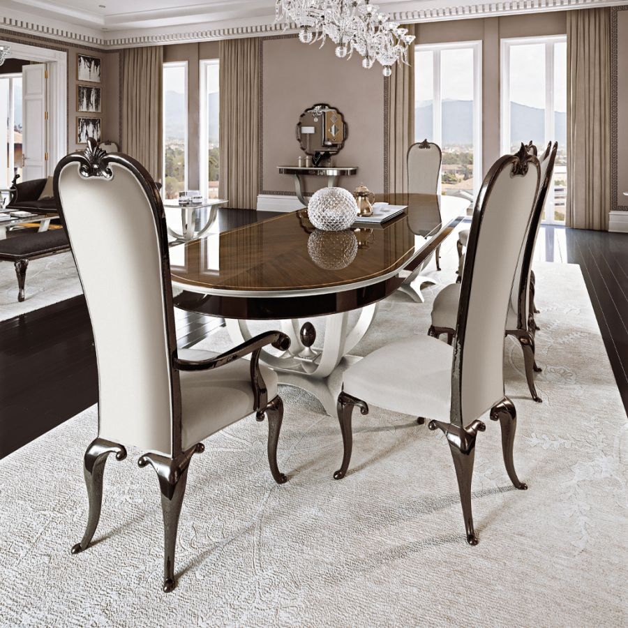 Close-up of a contemporary wooden sideboard from the new Pregno collection, emphasizing its smooth curved lines and lack of ornate carvings.