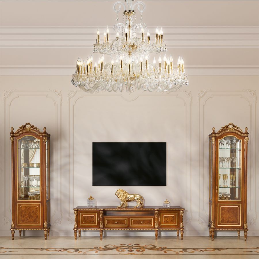 Elegant living room in the soft classic style, with a cream-colored sofa and brass accents embodying the principles of timeless living.