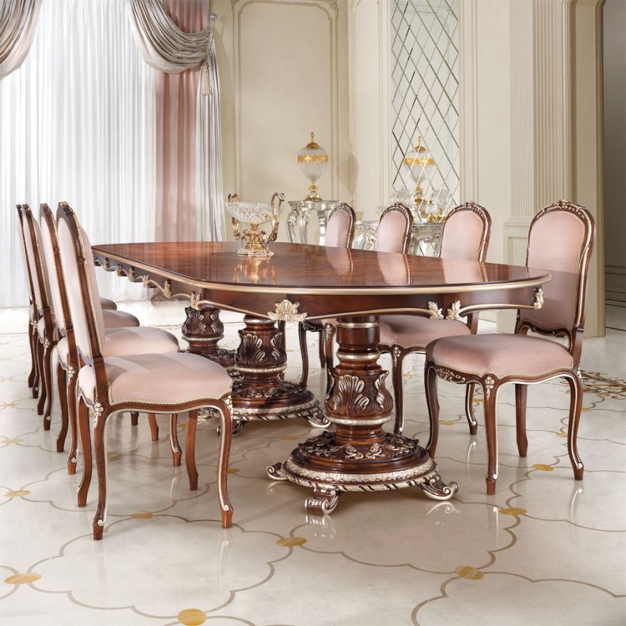 Detail shot of a timeless dining table setting with fine china and gold cutlery on a polished marble surface, embodying soft classic elegance.