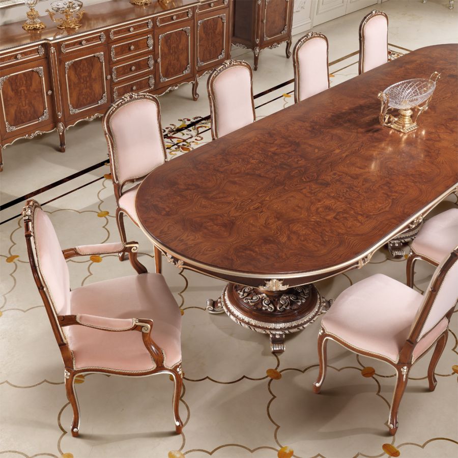 An elegant dining room with a neutral color palette, showcasing the principles of soft classic interior design with graceful furniture and soft lighting.