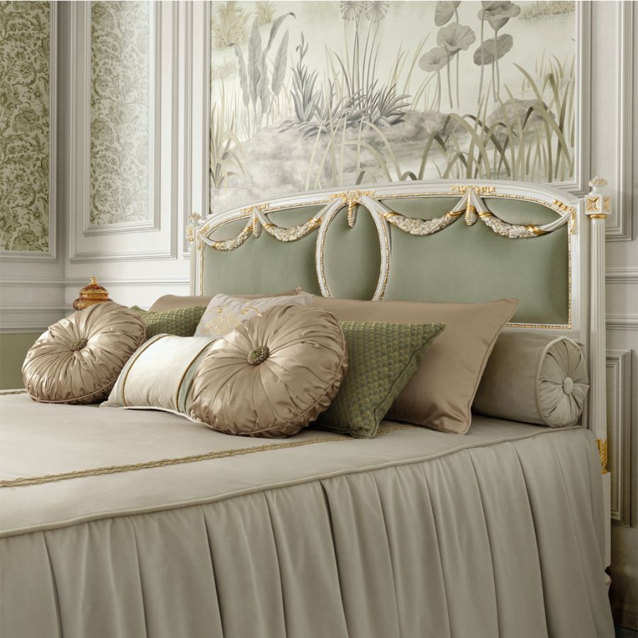 Luxurious layered bedding in cream and beige silk and velvet, demonstrating how rich textures enhance the elegant bedroom decor in a soft classic design.