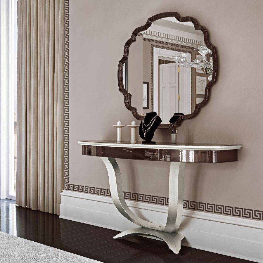 A beautifully set Modenese luxury dining table, prepared for an evening of elegant dining, with contemporary dinnerware complementing the classic furniture design.