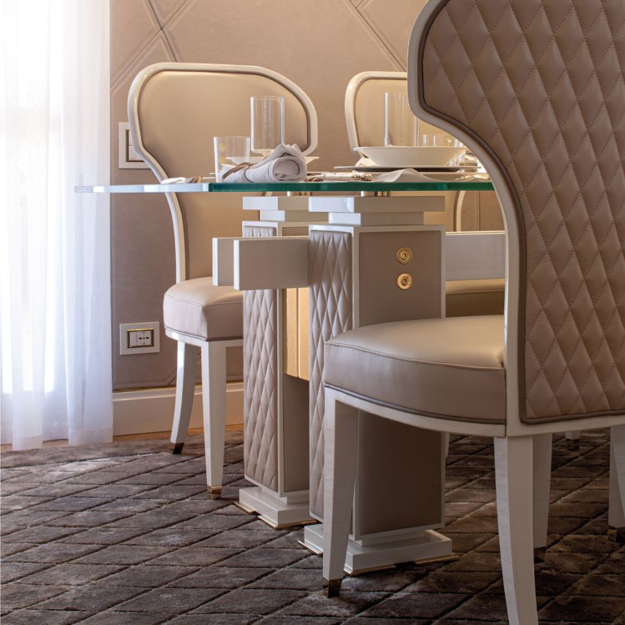 A close-up view of the EVOLUTION Dining rotating wall in motion, revealing a sophisticated champagne display with ambient backlighting.